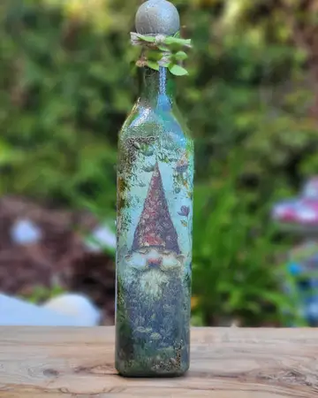 Bottle painted with a gnome and toadstool scene
