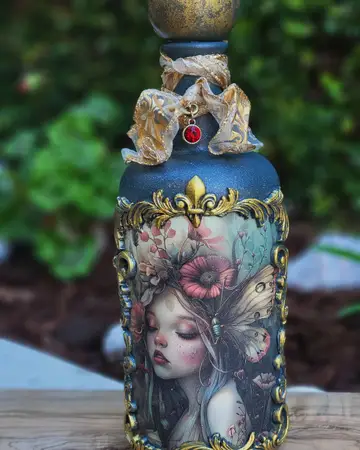 Ornate bottle with a painted portrait, gold framing and vintage jewellery