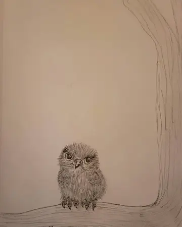 Small painted owl perched as a bottle topper