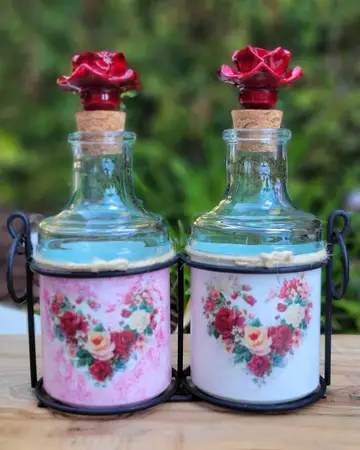 Pair of jars painted with floral hearts in pink and blue