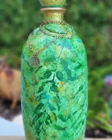 Emerald bottle painted with foliage and fine gold tracery