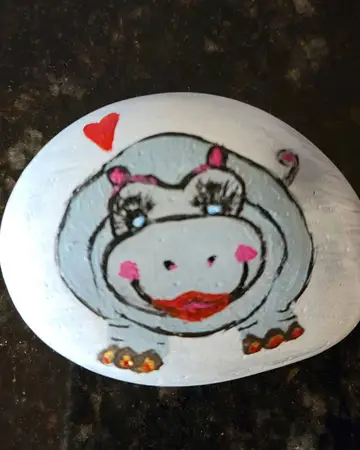 Round tray painted with a smiling face design