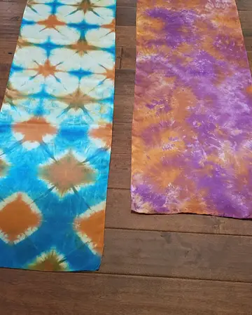 Two hand-dyed silk scarves in turquoise and violet