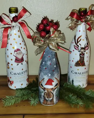 Christmas wine bottles decorated with reindeer and Santa designs