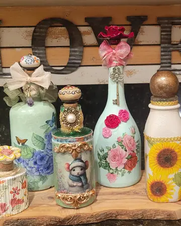 A shelf of decorated bottles displayed beneath large LOVE letters