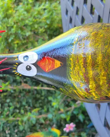 Bottle painted and shaped as a long-necked bird